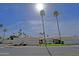 Street view of a modern neighborhood with palm trees, blue sky, and white houses at 629 E State Ave, Phoenix, AZ 85020