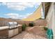 Backyard featuring a built-in grill and brick patio, perfect for outdoor cooking at 6439 W Kristal Way, Glendale, AZ 85308