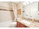 Well-maintained bathroom featuring granite counters, decorative mirror, and a shower-tub combo at 6439 W Kristal Way, Glendale, AZ 85308