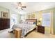 Serene Primary bedroom features en suite bathroom and large windows at 6439 W Kristal Way, Glendale, AZ 85308