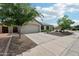 Charming single-story home featuring a two-car garage, meticulous landscaping, and a well-maintained yard at 6439 W Kristal Way, Glendale, AZ 85308