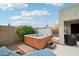 Relaxing hot tub situated near the patio offers a private retreat within the backyard at 6439 W Kristal Way, Glendale, AZ 85308