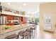 Bright kitchen with granite countertops, stainless steel appliances, and a breakfast bar with seating at 6439 W Kristal Way, Glendale, AZ 85308