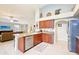 Well-appointed kitchen with cherry cabinets, stainless steel appliances, and granite countertops at 6439 W Kristal Way, Glendale, AZ 85308