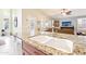 Gourmet kitchen with granite countertops, stainless steel appliances, and a view of the living area at 6439 W Kristal Way, Glendale, AZ 85308