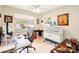 Well-lit home office with a view of the neighborhood at 6439 W Kristal Way, Glendale, AZ 85308