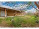 Large backyard area with covered patio and mature trees and cactus at 6837 W Camelback Rd, Phoenix, AZ 85033