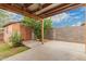 Backyard featuring a covered patio, storage shed, and block fence at 6837 W Camelback Rd, Phoenix, AZ 85033