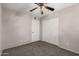 Bedroom featuring neutral walls, carpet floors, ceiling fan, and closet at 6837 W Camelback Rd, Phoenix, AZ 85033