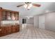 Open-concept kitchen featuring a center island, granite countertops, and tile flooring at 6837 W Camelback Rd, Phoenix, AZ 85033