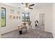 Bright bedroom featuring modern ceiling fan, neutral walls, gray carpet and a mirrored closet at 6900 E Princess Dr # 2247, Phoenix, AZ 85054