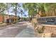 The front entrance to the Larronta Condominiums features beautiful desert landscaping and well maintained brick paver drive at 6900 E Princess Dr # 2247, Phoenix, AZ 85054