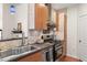 Well-equipped kitchen featuring stainless steel appliances, stone backsplash, and modern fixtures at 6900 E Princess Dr # 2247, Phoenix, AZ 85054