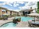 Community pool featuring ample seating, umbrellas and a hot tub with waterfall feature at 6900 E Princess Dr # 2247, Phoenix, AZ 85054