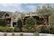 Exterior shot of a charming restaurant with an outdoor patio and stone fireplace at 6900 E Princess Dr # 2247, Phoenix, AZ 85054