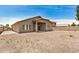 View of a xeriscaped backyard featuring a neutral-colored home at 726 E Heather Dr, San Tan Valley, AZ 85140