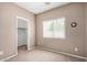 Neutral bedroom with a window and a view of the closet at 726 E Heather Dr, San Tan Valley, AZ 85140