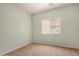 Small empty bedroom with neutral carpeting, a bright window, and painted in a soothing tone at 726 E Heather Dr, San Tan Valley, AZ 85140