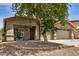 Welcoming single-story home featuring desert landscaping, a covered entry, and a three-car garage at 726 E Heather Dr, San Tan Valley, AZ 85140