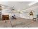 A large garage with overhead lighting, workbench, and exercise equipment at 726 E Heather Dr, San Tan Valley, AZ 85140