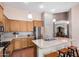 Beautiful kitchen with stainless steel appliances, granite countertops, a large island, and pendant lights at 726 E Heather Dr, San Tan Valley, AZ 85140
