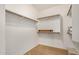 Spacious walk-in closet with built-in shelving and rods for organized storage at 726 E Heather Dr, San Tan Valley, AZ 85140
