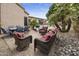 Backyard features a pool, palm trees, seating and a grill at 7262 W Firebird Dr, Glendale, AZ 85308