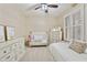Bright bedroom with shuttered window, ceiling fan and comfortable furnishings at 7262 W Firebird Dr, Glendale, AZ 85308