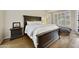 Comfortable bedroom with wood floors, large bed, and plenty of natural light at 7262 W Firebird Dr, Glendale, AZ 85308
