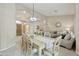 Elegant dining room with stylish furnishings and seamless flow to living area at 7262 W Firebird Dr, Glendale, AZ 85308