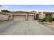 Charming single-story home with a two-car garage and desert landscaping at 7262 W Firebird Dr, Glendale, AZ 85308