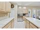 Bright kitchen featuring stainless steel appliances and light wood cabinetry at 7262 W Firebird Dr, Glendale, AZ 85308