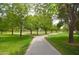 Scenic view of a park with manicured lawns and winding paved walkways at 7262 W Firebird Dr, Glendale, AZ 85308