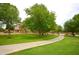 Beautiful park with lush green grass, mature trees, and walking paths at 7262 W Firebird Dr, Glendale, AZ 85308