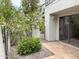 Backyard with a well maintained small garden, privacy wall and tiled patio, offering a private outdoor space at 7272 E Gainey Ranch Rd # 122, Scottsdale, AZ 85258