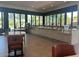 Stylish bar area with ample seating and large windows offering scenic views at 7272 E Gainey Ranch Rd # 122, Scottsdale, AZ 85258