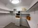 Walk-in closet with built-in shelving providing plenty of storage space at 7272 E Gainey Ranch Rd # 122, Scottsdale, AZ 85258