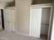 Bedroom closet with shelving and sliding doors at 7272 E Gainey Ranch Rd # 122, Scottsdale, AZ 85258