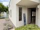 Inviting home exterior with a charming welcome sign near the front door and views of the water fountain at 7272 E Gainey Ranch Rd # 122, Scottsdale, AZ 85258