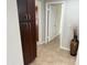 Hallway with tile flooring and closet space at 7272 E Gainey Ranch Rd # 122, Scottsdale, AZ 85258