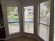 Bright kitchen nook with expansive windows offering serene views of the lake and fountain at 7272 E Gainey Ranch Rd # 122, Scottsdale, AZ 85258