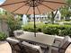 Inviting outdoor patio with comfortable seating, offering a relaxing spot to unwind and enjoy the beautiful scenery at 7272 E Gainey Ranch Rd # 122, Scottsdale, AZ 85258