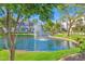 Beautiful pond with a fountain and well-maintained landscaping creates a serene community setting at 7272 E Gainey Ranch Rd # 122, Scottsdale, AZ 85258