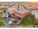 Aerial view of backyard with sparkling pool, lounge chairs, and a covered patio perfect for outdoor gatherings at 7503 S Roanoke St, Gilbert, AZ 85298
