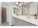 Bright bathroom features double sinks, modern fixtures and a shower and tub combination at 7503 S Roanoke St, Gilbert, AZ 85298