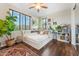 Cozy bedroom featuring a queen bed, built-in shelving, and large windows with lots of natural light at 7503 S Roanoke St, Gilbert, AZ 85298