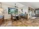 Inviting dining room featuring a large window, stylish table setting, and rustic wood accents at 7503 S Roanoke St, Gilbert, AZ 85298