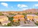 Beautiful two-story home featuring desert landscaping and a charming stone accents on a sunny day at 7503 S Roanoke St, Gilbert, AZ 85298