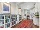 Stylish office with a built-in bookcase, a corner desk, and a view of the hallway at 7503 S Roanoke St, Gilbert, AZ 85298