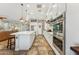 Modern kitchen with stainless steel appliances, island with bar seating, and a stylish open layout at 7503 S Roanoke St, Gilbert, AZ 85298